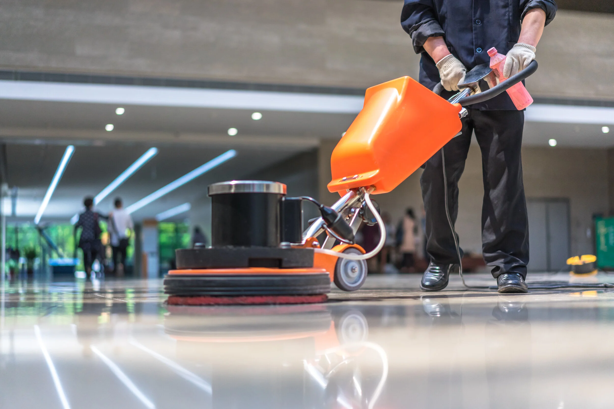 Commercial floor care technician polishing VCT flooring in a Central PA office building .