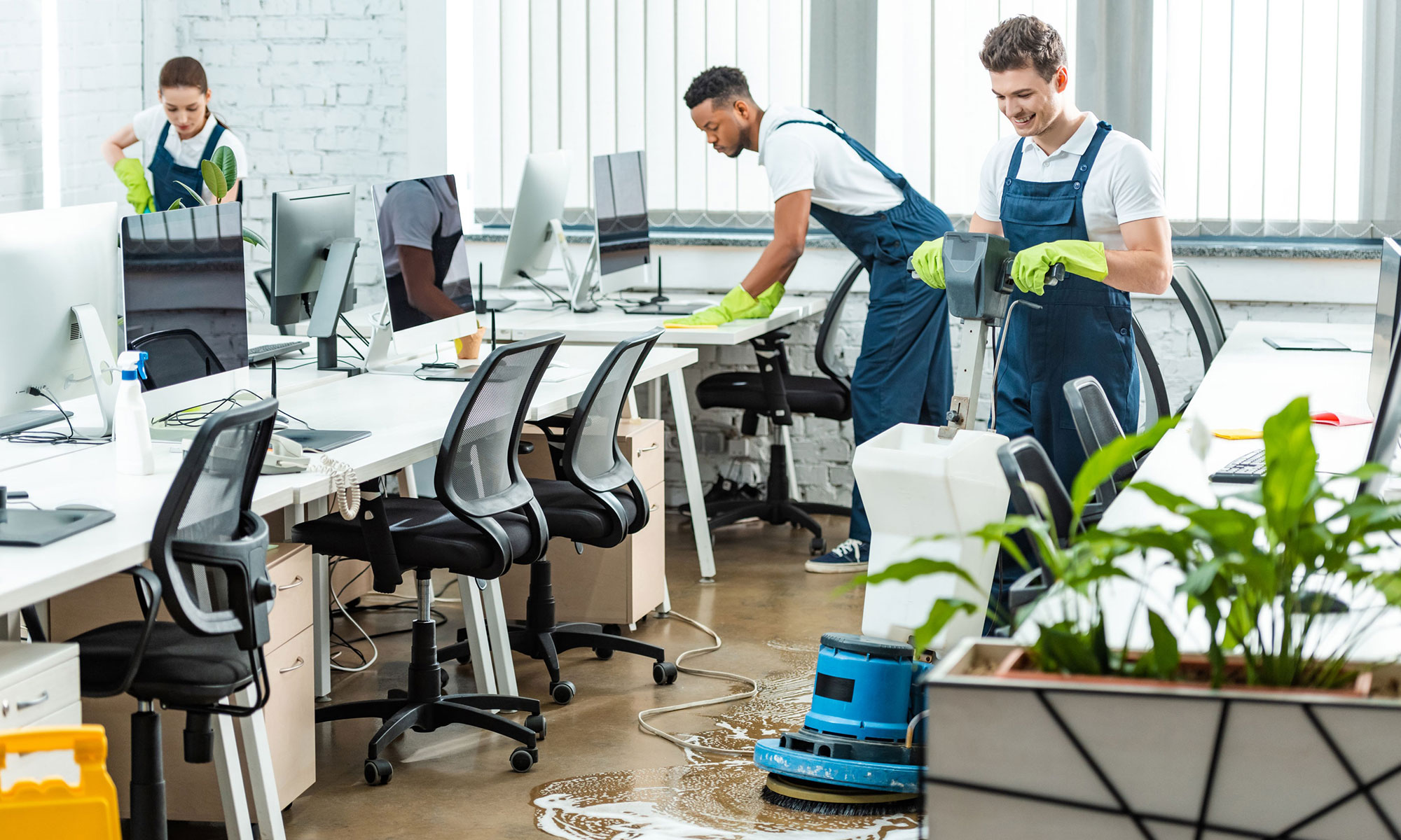 Office cleaning crew following a scheduled commercial cleaning plan .